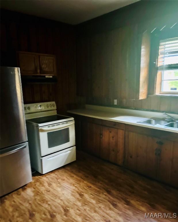 905 Milly Francis St, Wetumpka, AL 36092 - kitchen featuring freestanding refrigerator, white range with electric stovetop, range hood, and wood finished floors