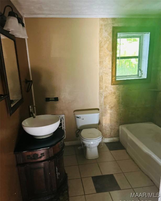 905 Milly Francis St, Wetumpka, AL 36092 - bathroom with tile patterned flooring, vanity, a bathtub, and crown molding