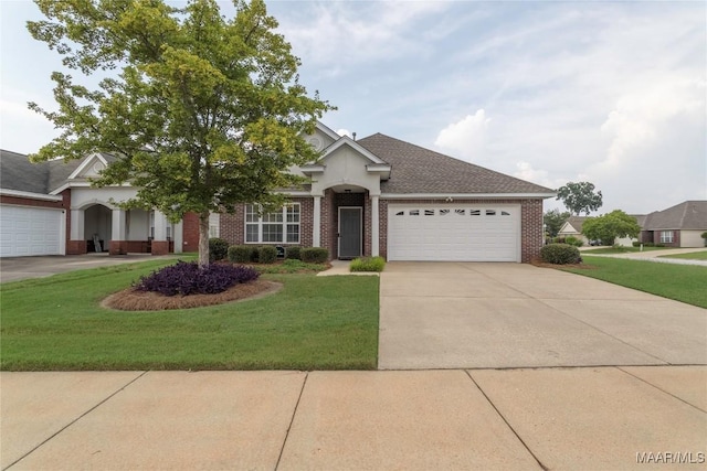 9621 Colleton Pl, Montgomery, AL 36117 - view of front facade with brick siding, a garage, and a front yard