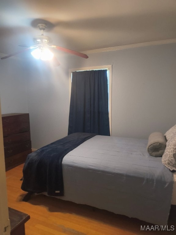 2205 Old Orrville Rd, Selma, AL 36701 - bedroom with crown molding, wood finished floors, and a ceiling fan