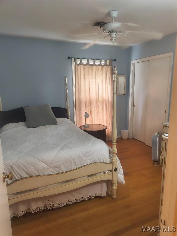 2205 Old Orrville Rd, Selma, AL 36701 - bedroom featuring light wood-style flooring, a closet, and ceiling fan
