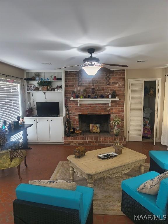 2205 Old Orrville Rd, Selma, AL 36701 - living area with ceiling fan and a fireplace