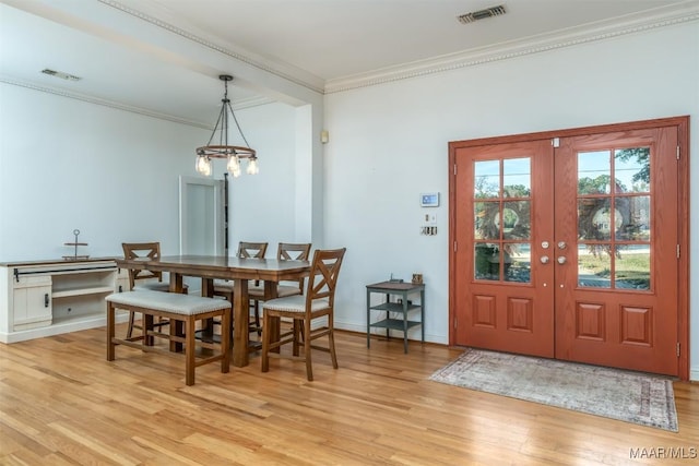 3900 Snowdoun Chambers Rd, Montgomery, AL 36116 - dining room featuring light wood-style floors, a chandelier, ornamental molding, and french doors