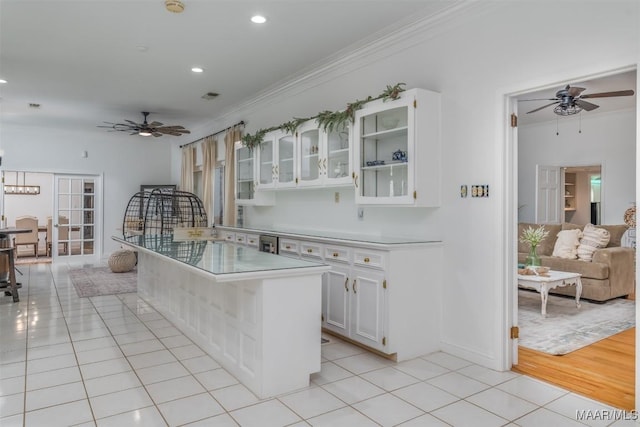 3900 Snowdoun Chambers Rd, Montgomery, AL 36116 - kitchen with ceiling fan, light tile patterned flooring, crown molding, white cabinets, and glass insert cabinets