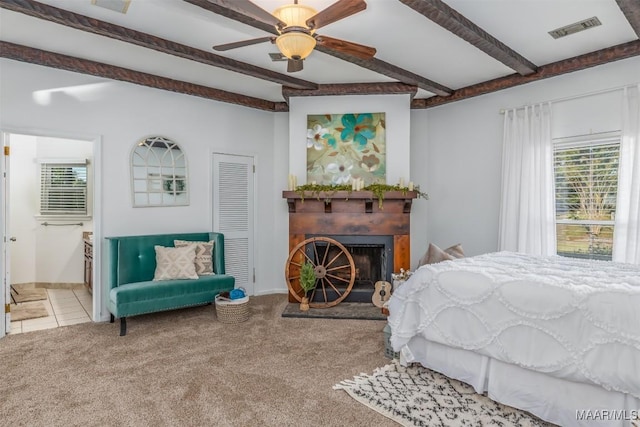3900 Snowdoun Chambers Rd, Montgomery, AL 36116 - carpeted bedroom with beam ceiling, a fireplace, ensuite bathroom, and ceiling fan