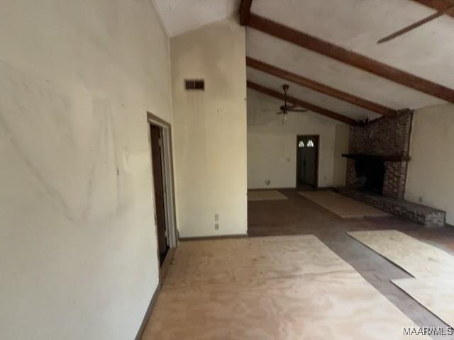 2711 Gwynnbrook Rd, Montgomery, AL 36116 - unfurnished living room with beamed ceiling, high vaulted ceiling, and a fireplace