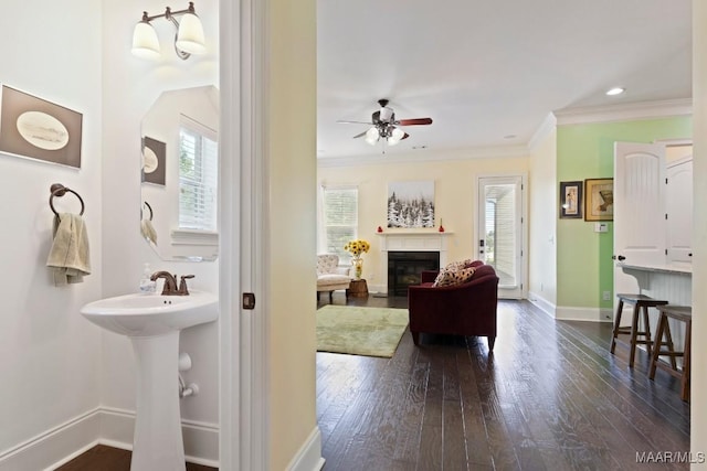 301 Eastgate Dr, Prattville, AL 36066 - living area with dark wood-style floors, a ceiling fan, crown molding, a glass covered fireplace, and recessed lighting