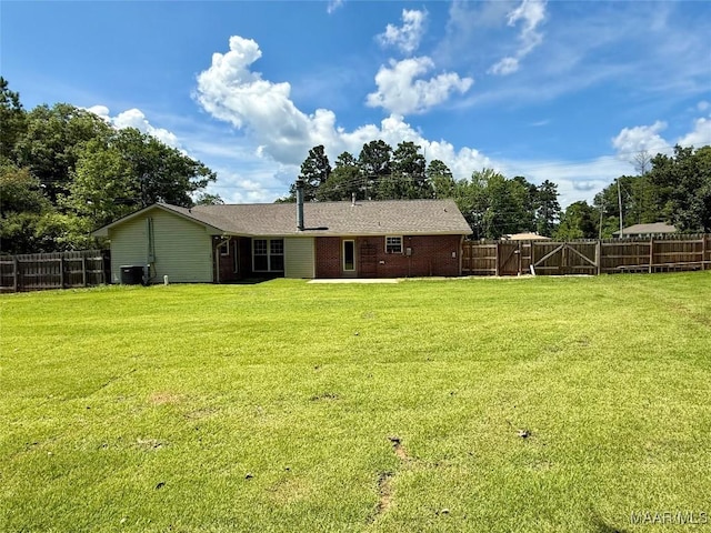 311 Old Marion Junction Rd, Selma, AL 36701 - back of house featuring a fenced backyard and brick siding