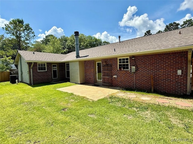 311 Old Marion Junction Rd, Selma, AL 36701 - back of house with a patio area, brick siding, and roof with shingles