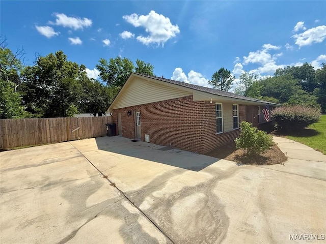 311 Old Marion Junction Rd, Selma, AL 36701 - view of side of home with brick siding and a patio