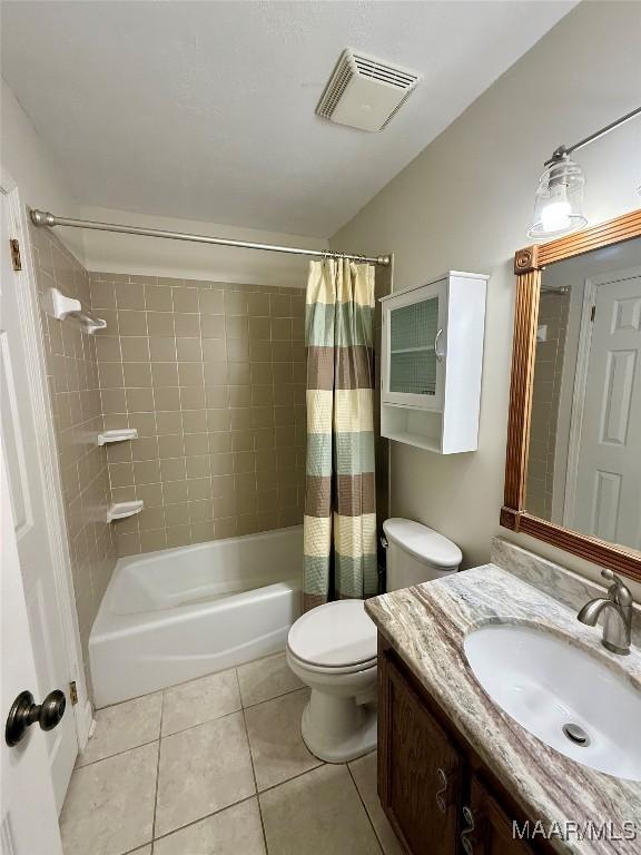 311 Old Marion Junction Rd, Selma, AL 36701 - bathroom featuring tile patterned flooring, vanity, and shower / bath combo with shower curtain
