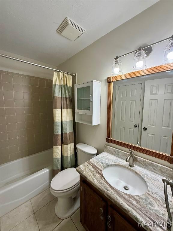 311 Old Marion Junction Rd, Selma, AL 36701 - bathroom featuring tile patterned flooring, vanity, and shower / bathtub combination with curtain