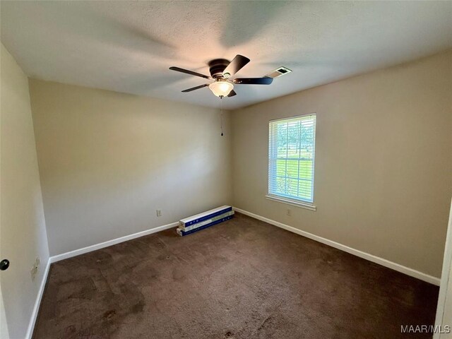 311 Old Marion Junction Rd, Selma, AL 36701 - empty room featuring a ceiling fan and dark carpet