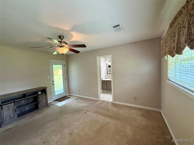 311 Old Marion Junction Rd, Selma, AL 36701 - unfurnished living room featuring light carpet and ceiling fan