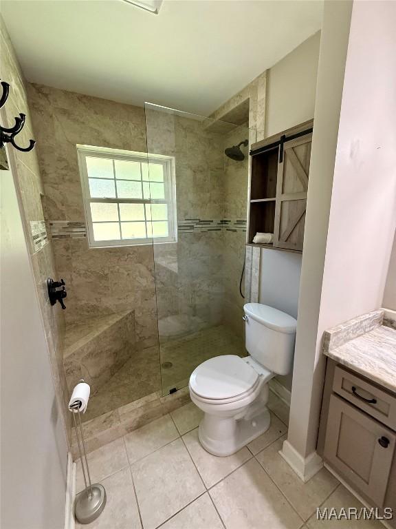 311 Old Marion Junction Rd, Selma, AL 36701 - full bath featuring walk in shower, tile patterned floors, and vanity