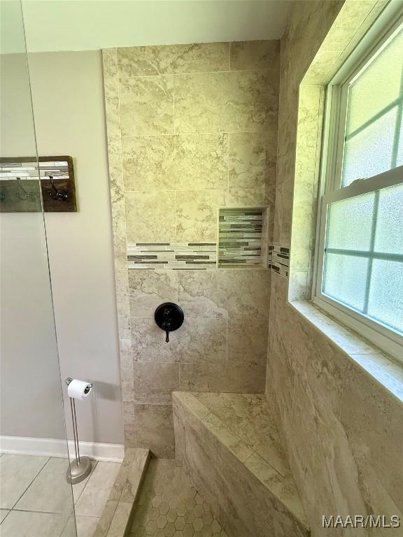 311 Old Marion Junction Rd, Selma, AL 36701 - bathroom with tiled shower and tile patterned floors