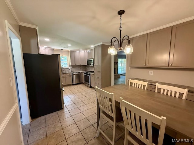 311 Old Marion Junction Rd, Selma, AL 36701 - dining area featuring crown molding, light tile patterned flooring, recessed lighting, and a chandelier