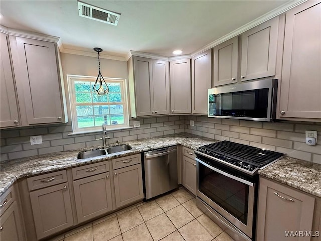 311 Old Marion Junction Rd, Selma, AL 36701 - kitchen featuring stainless steel appliances, tasteful backsplash, light tile patterned flooring, crown molding, and decorative light fixtures