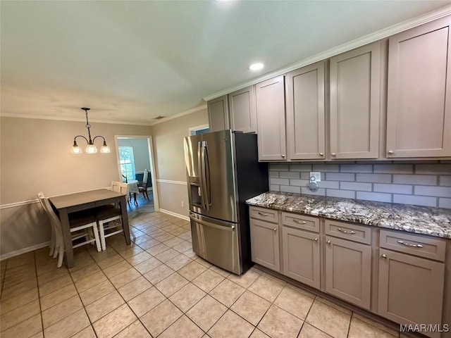 311 Old Marion Junction Rd, Selma, AL 36701 - kitchen featuring stainless steel fridge with ice dispenser, gray cabinetry, light tile patterned floors, backsplash, and a chandelier