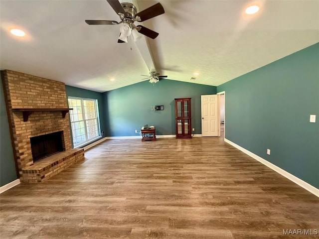 311 Old Marion Junction Rd, Selma, AL 36701 - unfurnished living room with a ceiling fan, wood finished floors, a brick fireplace, and recessed lighting