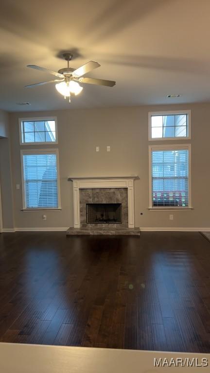 1008 Overture Dr, Montgomery, AL 36117 - unfurnished living room featuring healthy amount of natural light, a fireplace, and wood-type flooring