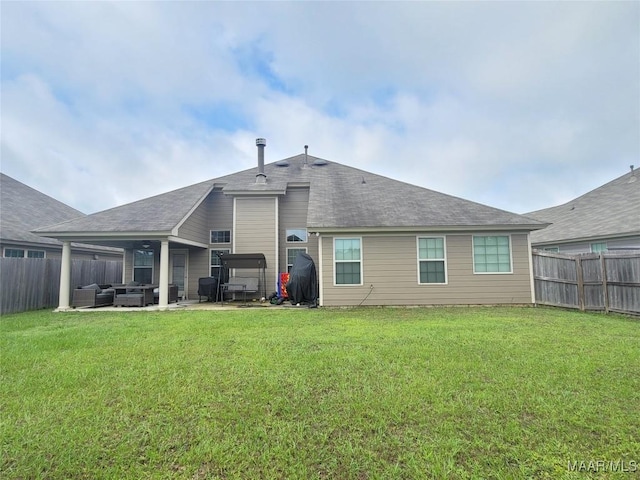 1008 Overture Dr, Montgomery, AL 36117 - rear view of house with a fenced backyard, an outdoor living space, and a patio