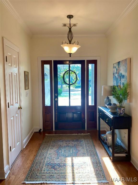 5650 Ash Grove Ct, Montgomery, AL 36116 - foyer featuring wood finished floors and crown molding