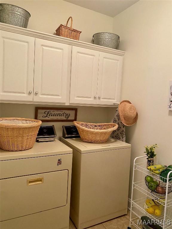 5650 Ash Grove Ct, Montgomery, AL 36116 - laundry area featuring cabinet space and washer and clothes dryer