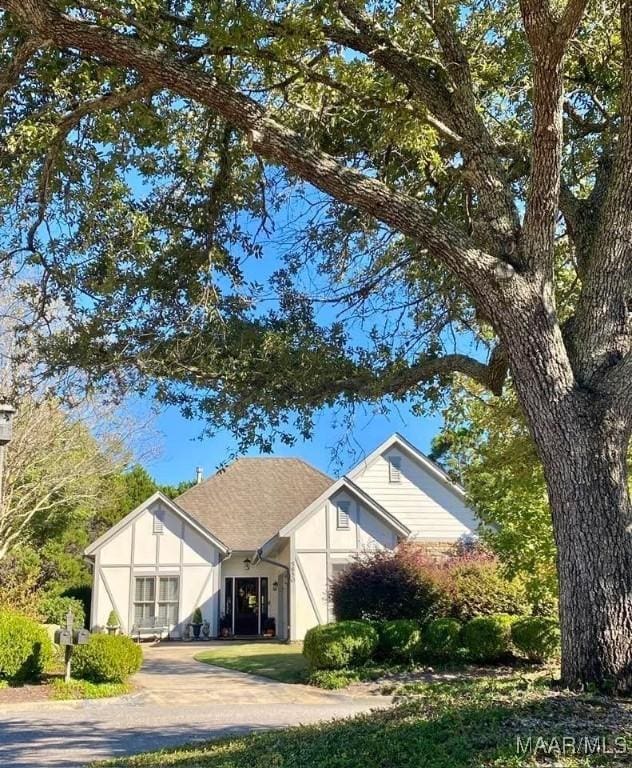 5650 Ash Grove Ct, Montgomery, AL 36116 - view of front of property with concrete driveway, stucco siding, and a garage