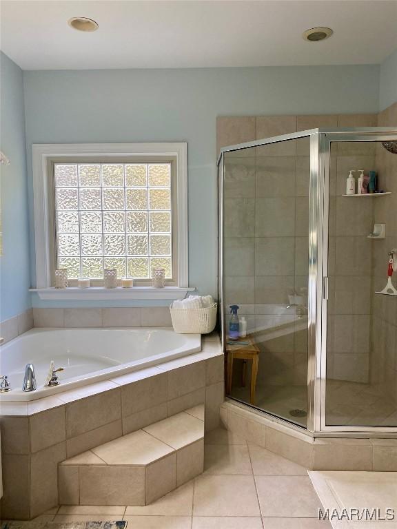 5650 Ash Grove Ct, Montgomery, AL 36116 - bathroom featuring a garden tub, a stall shower, and tile patterned floors