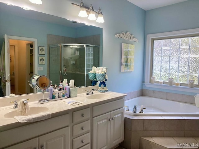 5650 Ash Grove Ct, Montgomery, AL 36116 - full bath featuring a stall shower, double vanity, and a garden tub
