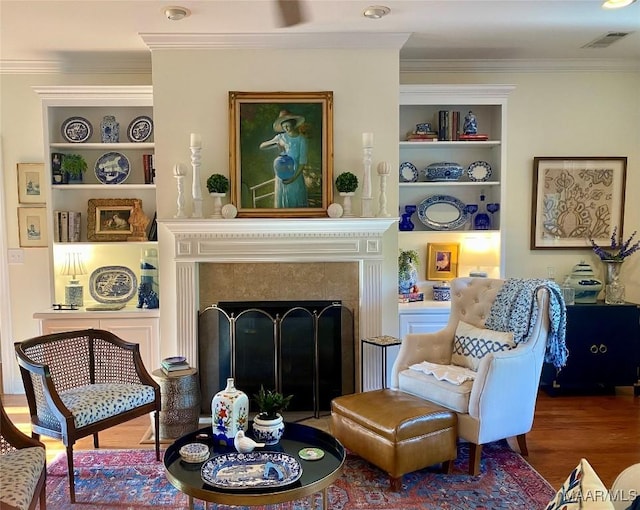 5650 Ash Grove Ct, Montgomery, AL 36116 - living area featuring wood finished floors, a high end fireplace, built in shelves, and crown molding