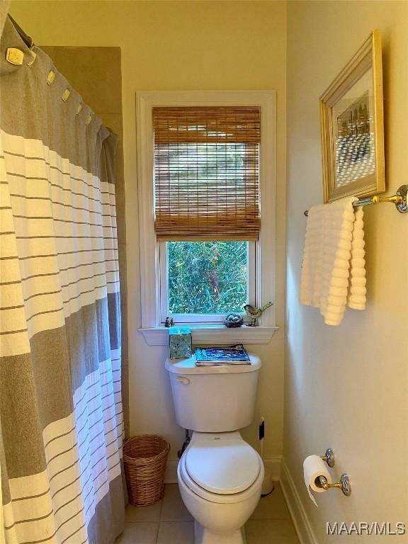 5650 Ash Grove Ct, Montgomery, AL 36116 - full bath with tile patterned floors and a shower with shower curtain