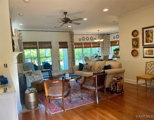 5650 Ash Grove Ct, Montgomery, AL 36116 - living area with crown molding, a ceiling fan, wood finished floors, a chandelier, and recessed lighting