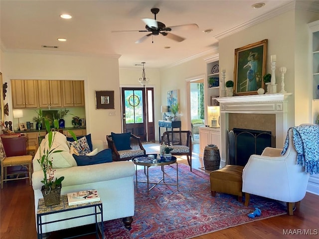 5650 Ash Grove Ct, Montgomery, AL 36116 - living room with dark wood-style floors, a ceiling fan, crown molding, a fireplace, and recessed lighting