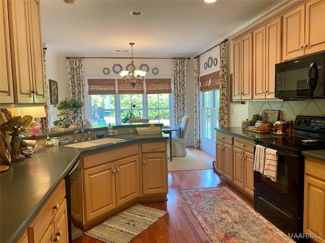 5650 Ash Grove Ct, Montgomery, AL 36116 - kitchen with black appliances, dark countertops, backsplash, dark wood-style floors, and a peninsula
