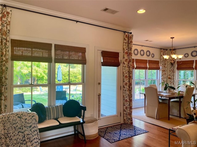 5650 Ash Grove Ct, Montgomery, AL 36116 - doorway to outside with ornamental molding, a chandelier, wood finished floors, healthy amount of natural light, and recessed lighting