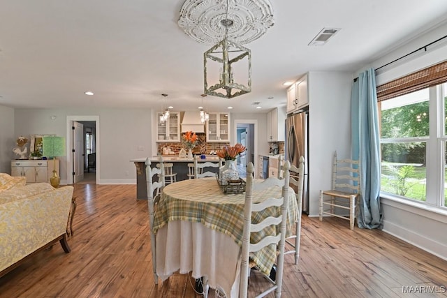 31 Colley Rd, Wetumpka, AL 36092 - dining area featuring plenty of natural light, wood finished floors, recessed lighting, and a chandelier
