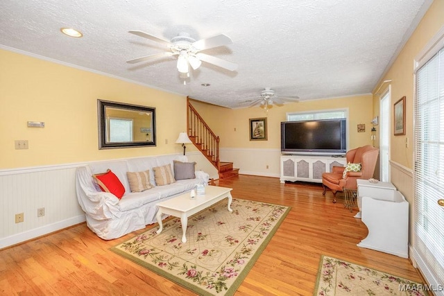 471 Beachwood Rd, Wetumpka, AL 36092 - living room with a textured ceiling, wood finished floors, a ceiling fan, stairs, and plenty of natural light