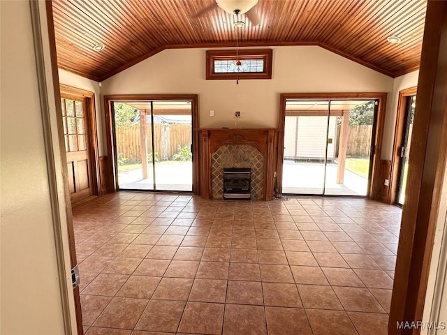 3551 Dalraida Pkwy, Montgomery, AL 36109 - unfurnished living room featuring wood ceiling, lofted ceiling, tile patterned floors, plenty of natural light, and a tile fireplace