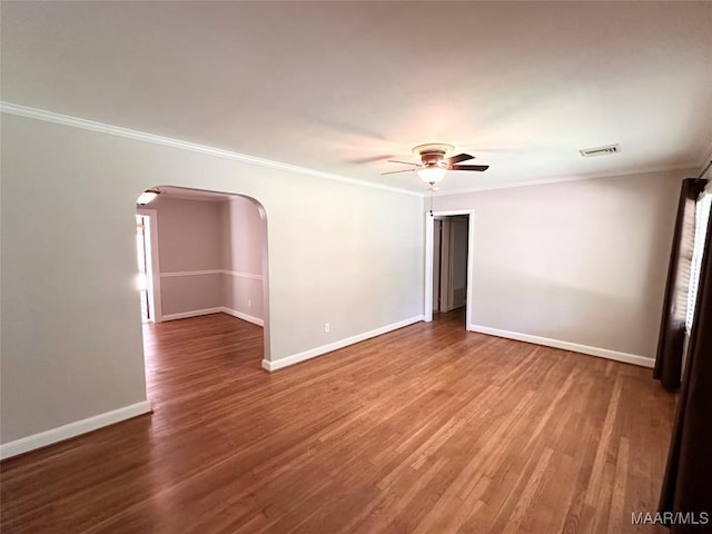 3551 Dalraida Pkwy, Montgomery, AL 36109 - unfurnished room with arched walkways, ceiling fan, crown molding, and wood finished floors