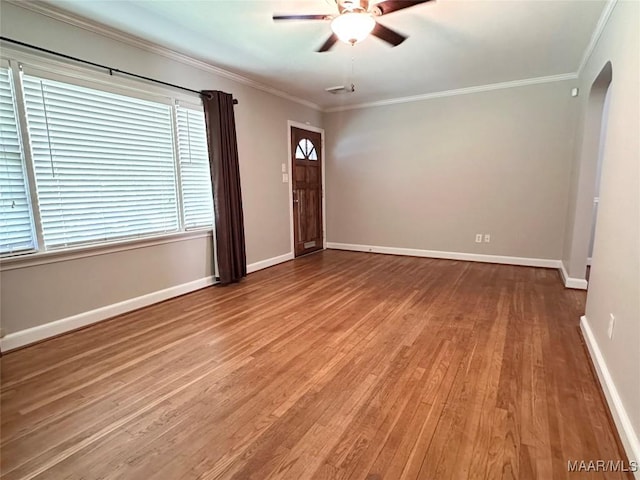 3551 Dalraida Pkwy, Montgomery, AL 36109 - empty room with arched walkways, wood finished floors, ceiling fan, and crown molding