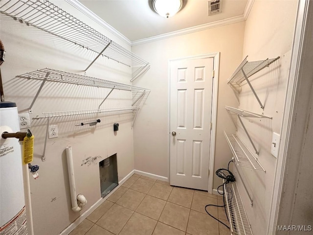 3551 Dalraida Pkwy, Montgomery, AL 36109 - laundry area featuring ornamental molding, light tile patterned floors, water heater, and electric dryer hookup