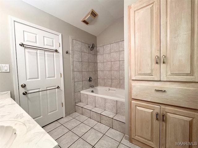 3551 Dalraida Pkwy, Montgomery, AL 36109 - bathroom with tile patterned flooring, double vanity, tiled shower / bath combo, and lofted ceiling