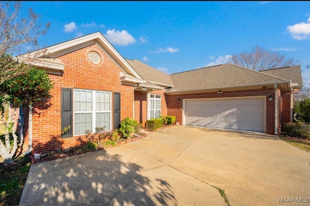 9832 Helmsley Cir, Montgomery, AL 36117 - view of front of home featuring brick siding, concrete driveway, a garage, and a shingled roof