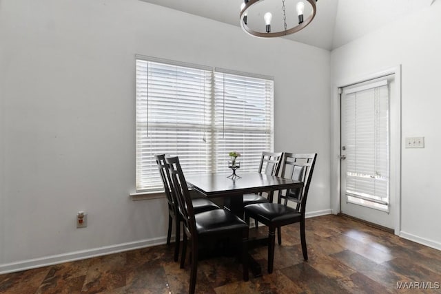 6526 Ridgeview Ln, Montgomery, AL 36116 - dining room with stone finish flooring, a chandelier, and vaulted ceiling