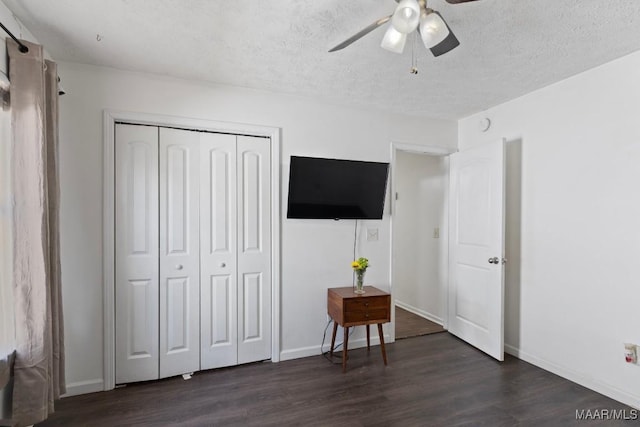 6526 Ridgeview Ln, Montgomery, AL 36116 - bedroom featuring dark wood-type flooring, a closet, a textured ceiling, and ceiling fan