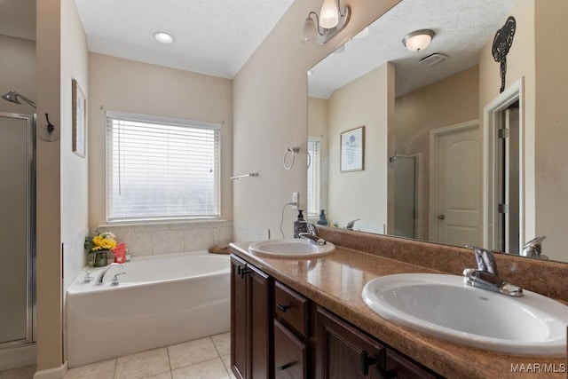 6526 Ridgeview Ln, Montgomery, AL 36116 - bathroom with a stall shower, double vanity, a bath, and tile patterned floors
