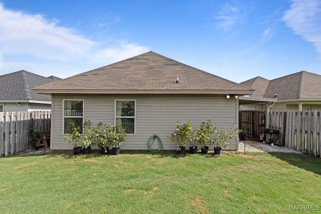 6526 Ridgeview Ln, Montgomery, AL 36116 - rear view of property featuring a fenced backyard and roof with shingles