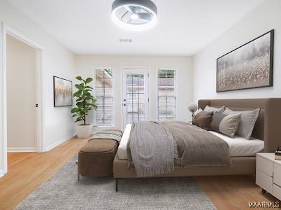 1243 Highpoint Rd, Montgomery, AL 36109 - bedroom with wood finished floors and baseboards